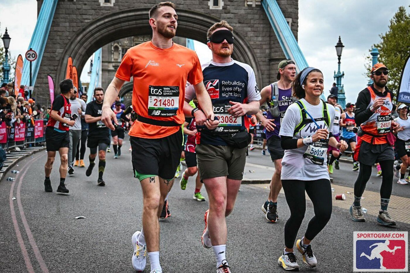 Kieren running the London Marathon blindfolded, guided across Tower Bridge