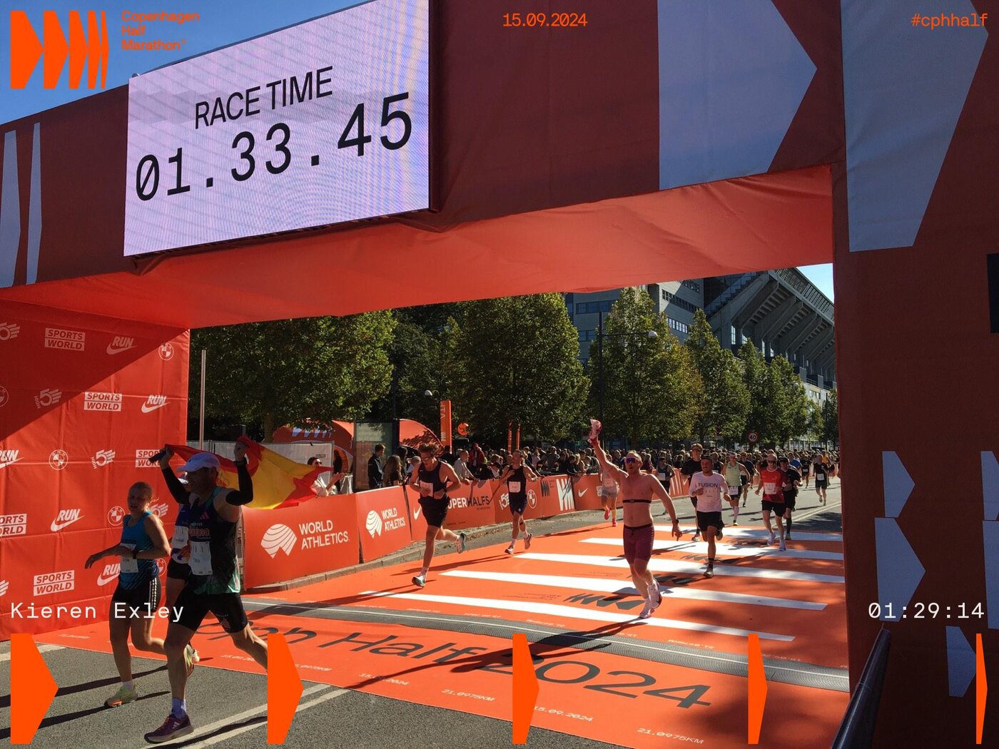 Kieren crossing the Copenhagen Half Marathon finish line